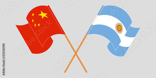 Crossed and waving flags of Argentina and China
