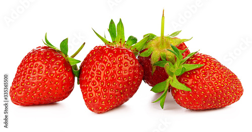 Strawberries with leaves isolated on a white background.