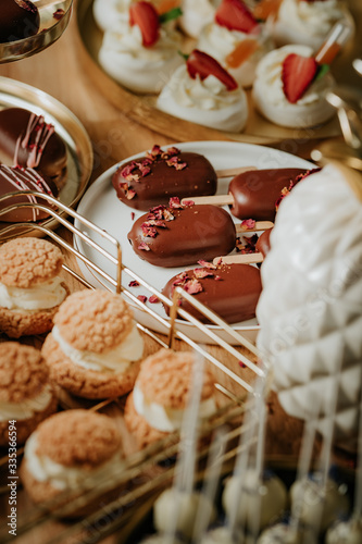 Sweet table at a wedding, monoportions and other sweets, cakesicles photo