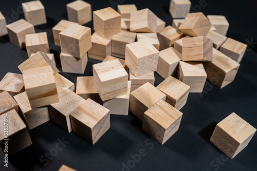 Wooden cubes on the black background