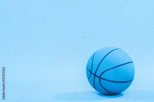 Basketball ball isolated on blue background.