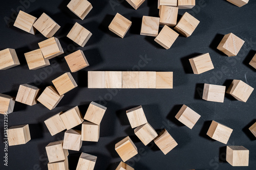 Wooden cubes on the black background