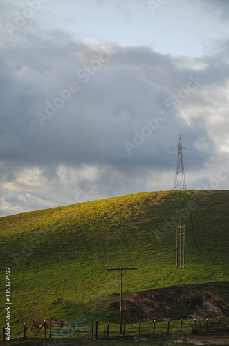 Portrait of antenna on hill during sunset