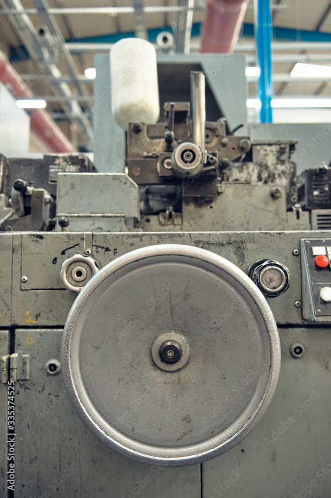 A toilet paper making machine, producing toilet and bathroom paper rolls due to Corona virus panic buying. Paper and tissue manufacturers factory and engineered machinery. A toilet paper making machine, producing toilet and bathroom paper rolls due to Corona virus panic buying. Paper and tissue manufacturers factory and engineered machinery.