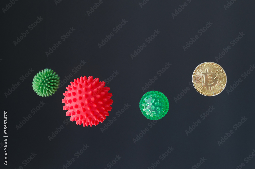 Red microbe molecule of the coronavirus virus vs Bitcoin coin. Conceptual. Red microbe molecule of the coronavirus virus vs Bitcoin coin. Conceptual.