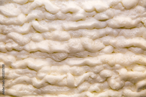 Fotografie Type of insulation polyurethane sprayed white in the form of clouds, backgrounds, construction, textures, design