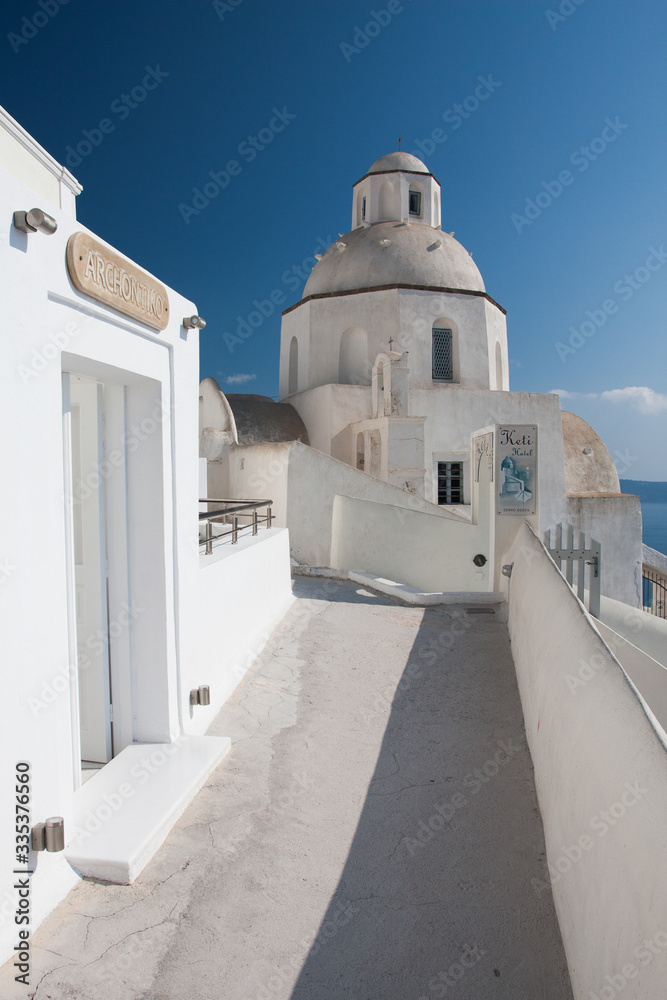 Santorini island, Greece, Aegan Sea. Traditional and famous white houses and churches with sea view