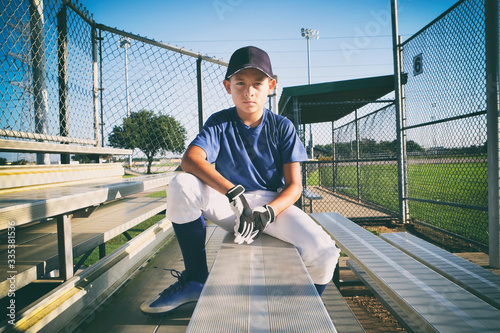 Photography Male child baseball player sitting on bleachers