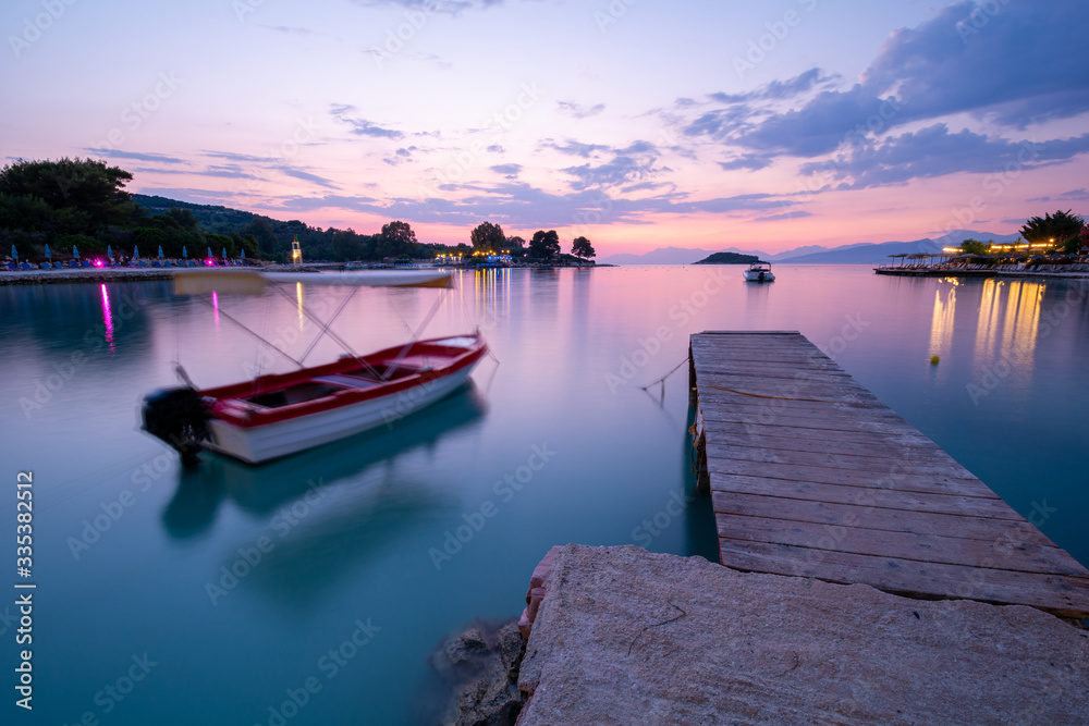boat on sea, long time exposure during dusk in Albania boat on sea, long time exposure during dusk in Albania
