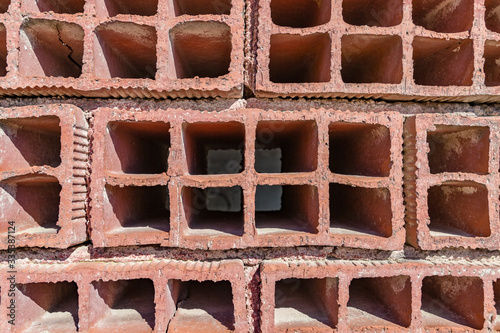 Brick wall of red color, wide panorama of masonry. Background of old vintage brick wall