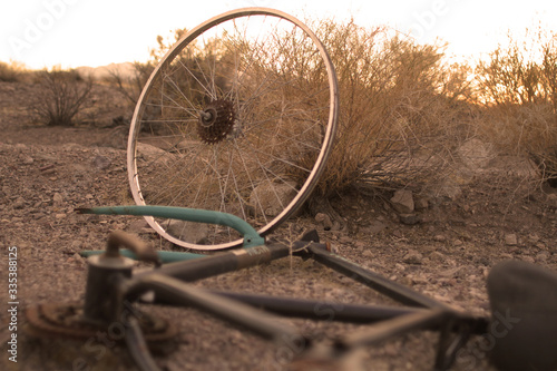 rusted broken bike left in the desert