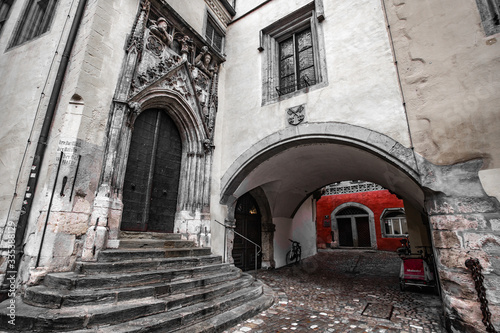 Black and white shot with red elements of Regensburg old town hall of Regensburg © maxim