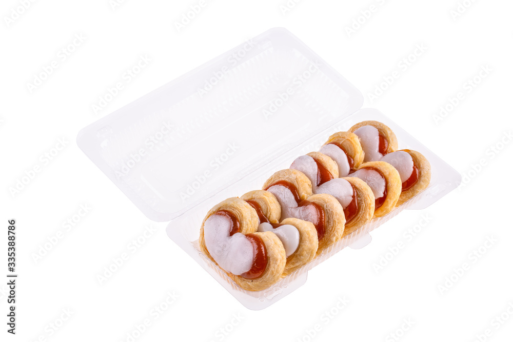 Sand cookies with jam and white glaze in plastic packaging
Sand cookies with jam and white glaze in plastic packaging
