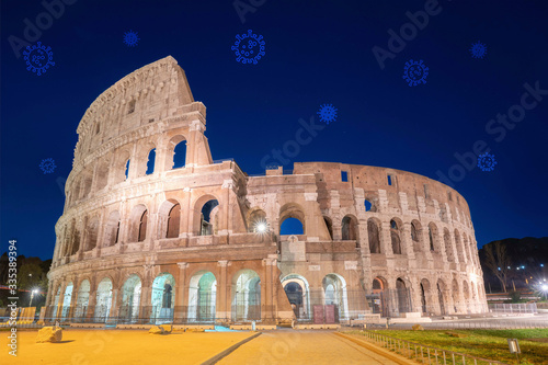 Night View of Colosseum, Rome Italy  with Covid-19 or Corona Virus in the Sky photo