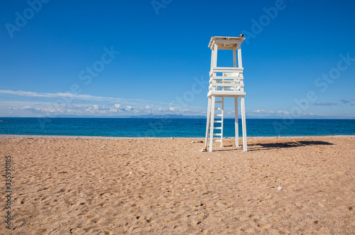 Fototapeta Naklejka Na Ścianę i Meble -  Lifeguard tower on the sandy beach of suburb in South Athens located in the Athens Riviera, Greece.