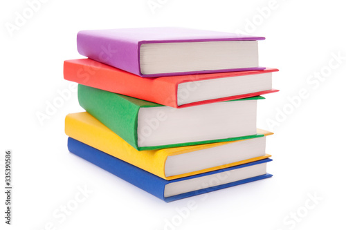 Stack of colorful books isolated on white background. Collection of different books. Hardback books for reading. Back to school and education learning concept
