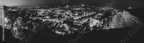 wide angle background b&w image of tbilisi panorama from Narikala fortress at night.Historical sites in Georgia. Blank space. 2020