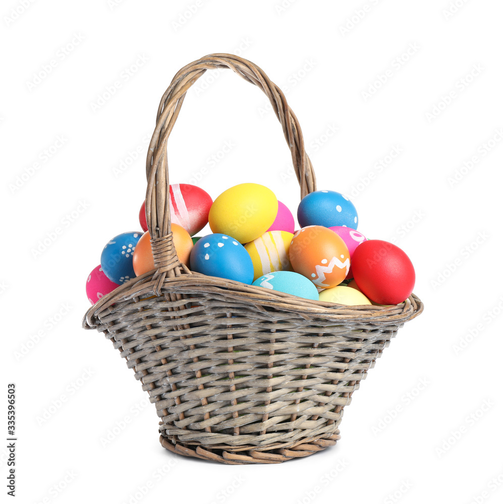 Basket with colorful Easter eggs isolated on white Basket with colorful Easter eggs isolated on white