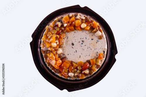 Berry cake with nuts in packaging
