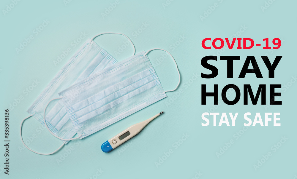 Home quarantine from Covid-19. Recommendation to prevent spreading Coronavirus, Covid 19 lockdown, Stay safe by stay home medicine concept. Medical mask on blue background. Home quarantine from Covid-19. Recommendation to prevent spreading Coronavirus, Covid 19 lockdown, Stay safe by stay home medicine concept. Medical mask on blue background.
