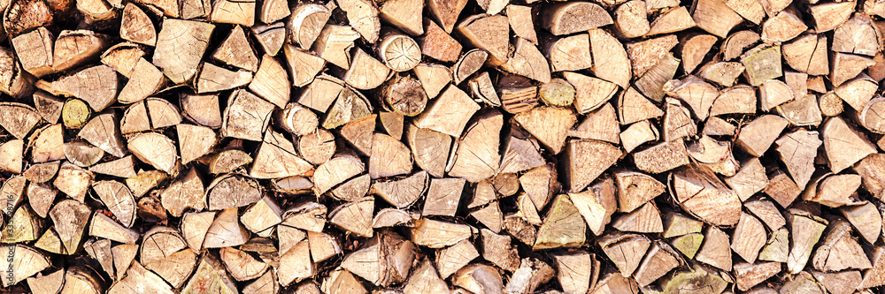 logs of firewood stacked on country yard in big pile outdoor logs of firewood stacked on country yard in big pile outdoor