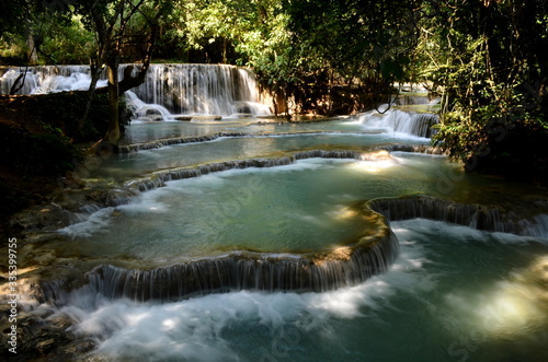 Turquoise water of the Kuang Si waterfalls in Laos