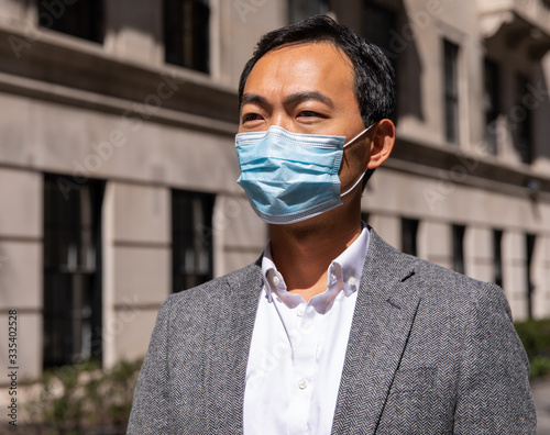 portrait of a young man with face mask due to coronavirus