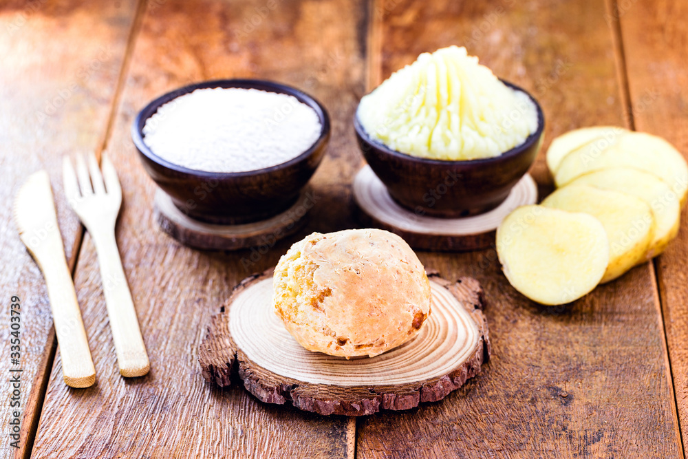 Vegan cheese bread, made without animal products, with ingredients on the side, tapioca and potatoes. Wooden sign with inscription: Vegan life. Vegan cheese bread, made without animal products, with ingredients on the side, tapioca and potatoes. Wooden sign with inscription: Vegan life.