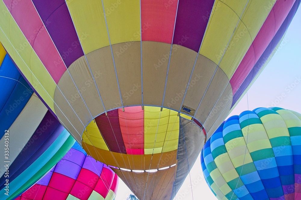 Obraz premium The atmosphere oat the balloon festival was fun and exciting to watch as the team members worked together to fill and launch the balloons.