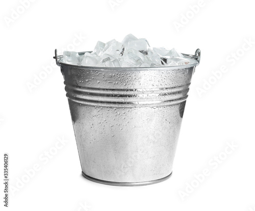 Metal bucket with ice cubes isolated on white