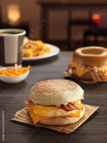 Leinwand Poster sandwich with egg and bacon, cheese for breakfast composition on a table with ka