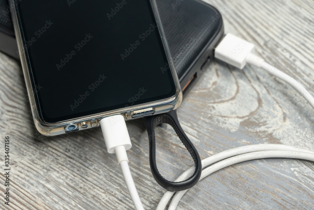 Flay lay of phone and charging devices, power storage and charging cable Flay lay of phone and charging devices, power storage and charging cable
