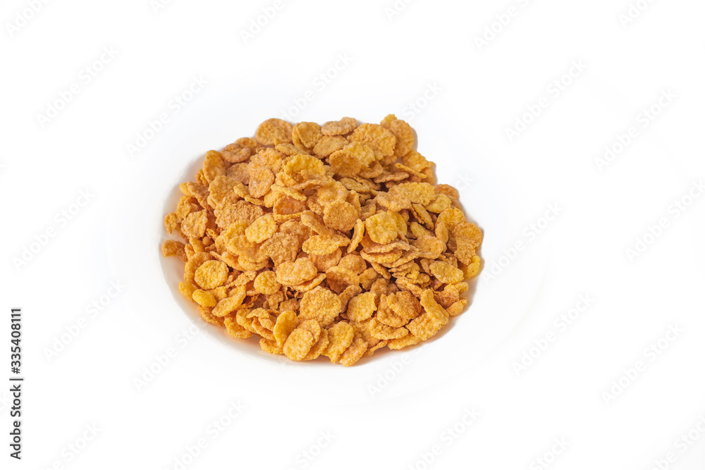 Flakes. Plate on a white background. Close-up. Is isolated Flakes. Plate on a white background. Close-up. Is isolated