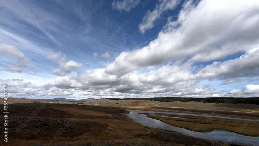 Time lapse of the Yellowstone River in the Hayden Valley, Yellowstone National Park. Camera pans left to right. Clouds moving left to right. Time lapse of the Yellowstone River in the Hayden Valley, Yellowstone National Park. Camera pans left to right. Clouds moving left to right.