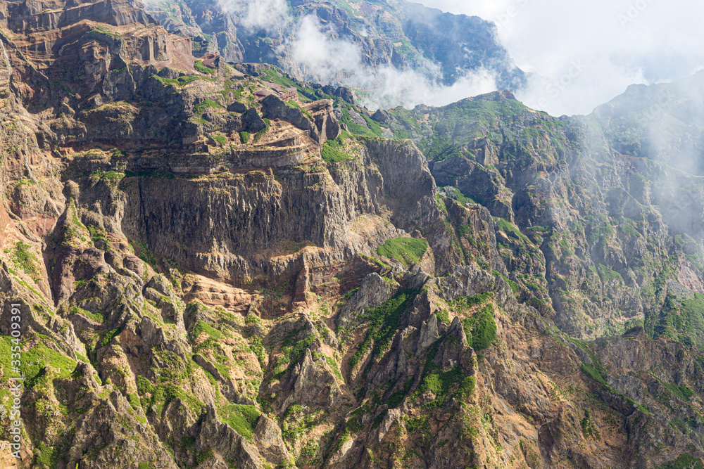 Landscape with a tourist trail in the mountains of Madeira, Portugal on a sunny summer day.