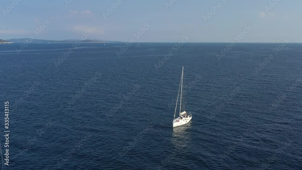 Ranks from yachts of participants of a regatta goes on a start point, is a sailing race at Croatia, reflection of sails on water, boat number aft boats Ranks from yachts of participants of a regatta goes on a start point, is a sailing race at Croatia, reflection of sails on water, boat number aft boats