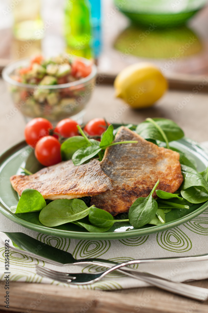 Fried Fish Fillet with Fresh Spinach and Tomatoes Fried Fish Fillet with Fresh Spinach and Tomatoes