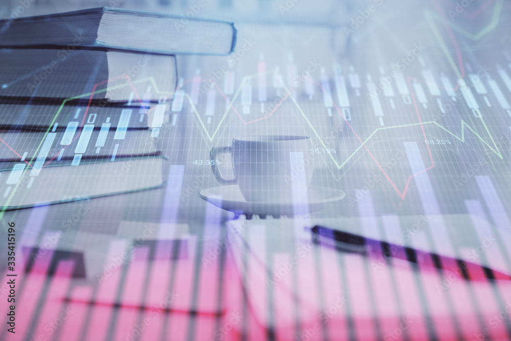 Double exposure of financial chart drawing and desktop with coffee and items on table background. Concept of forex market trading