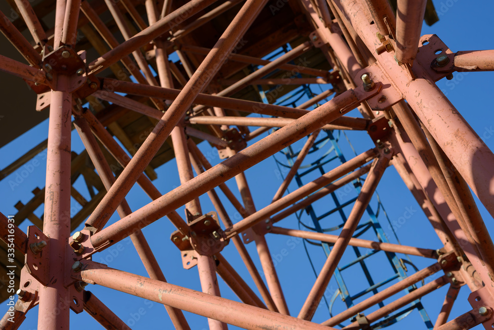 Scaffolding Elements Construction. Metal scaffolding tubes and bars. Construction site details. Bridge support. Industrial background. Scaffolding Elements Construction. Metal scaffolding tubes and bars. Construction site details. Bridge support. Industrial background.