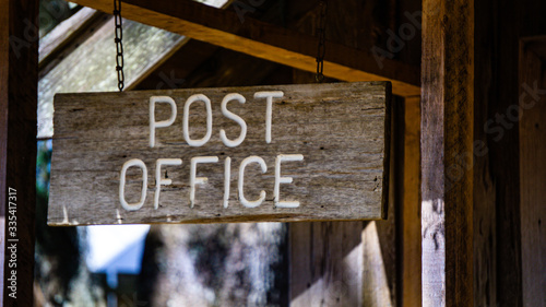 Old wooden sign for post offce photo