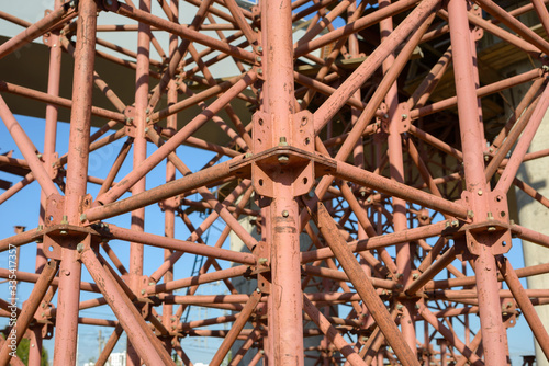 Scaffolding Elements Construction. Metal scaffolding tubes and bars. Construction site details. Bridge support. Industrial background. © Сyrustr