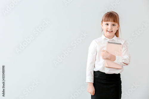 Cute little waiter on light...