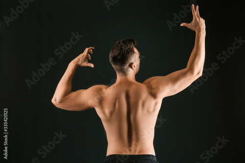 Sporty man on dark backgrou...