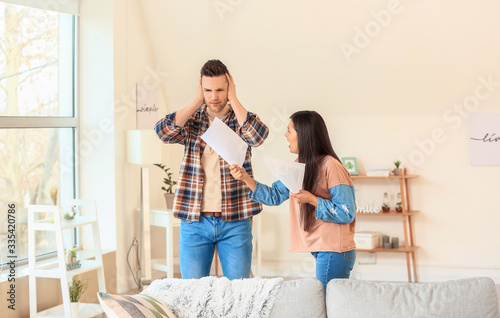 Displeased woman scolding h...