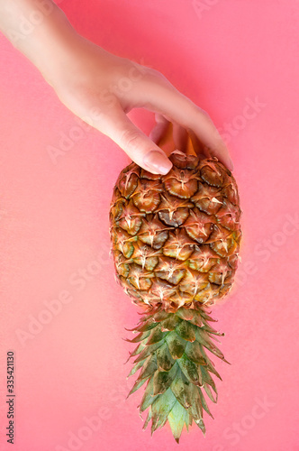 hand holding gradient pineapple summer fruit ,vitamin dietry close up photo