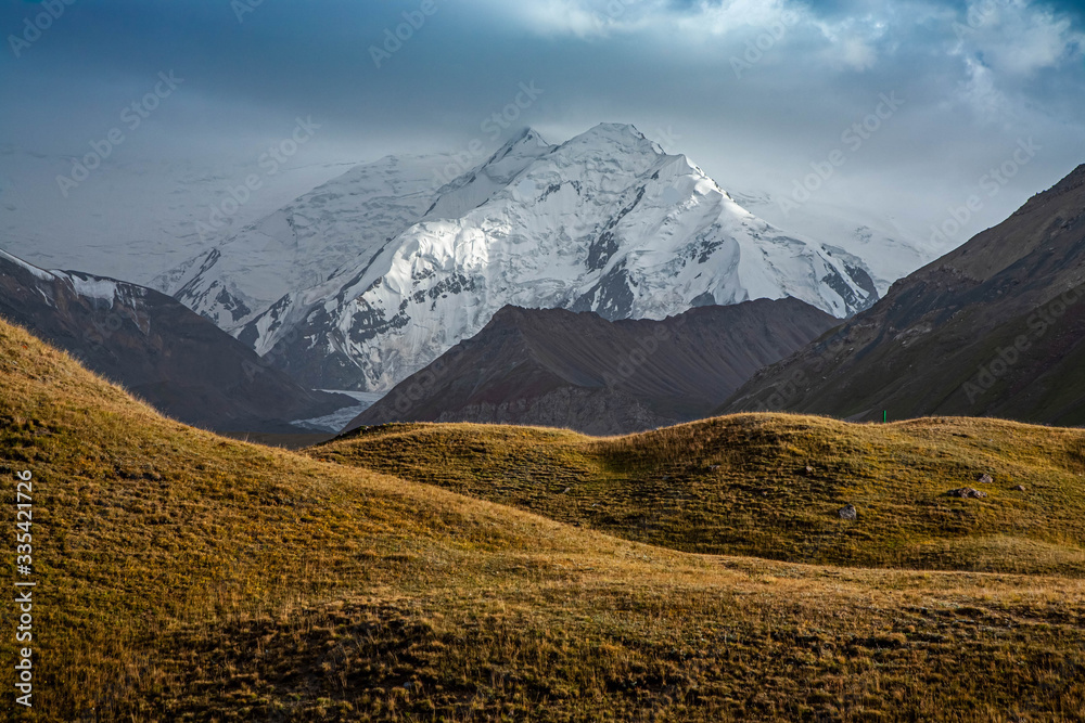 Fototapeta premium Scenic landscape of mountain in Kyrgyzstan. The Trans-Alay Range. Pamir Mountain System. Cloudy day.