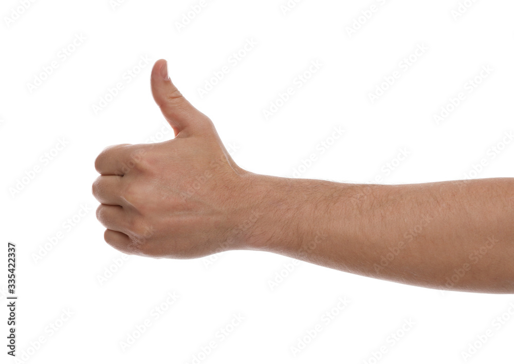 Man showing thumb up gesture against white background, closeup of hand Man showing thumb up gesture against white background, closeup of hand