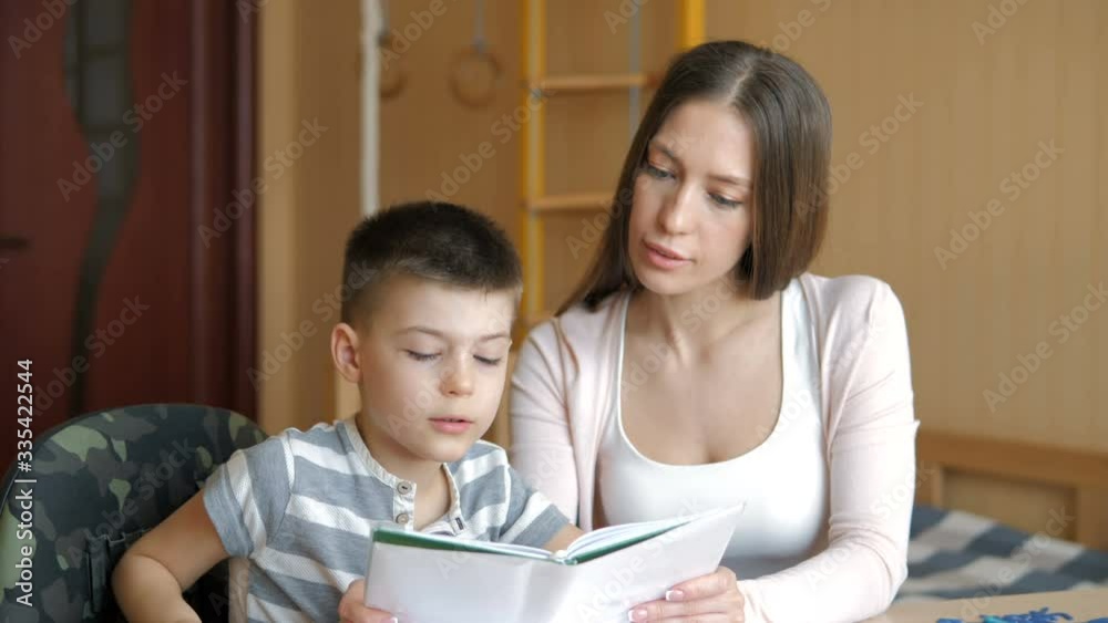 Home schooling. Mother and son doing art supplies homework Home schooling. Mother and son doing art supplies homework