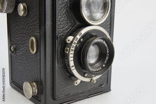 Closeup of a vintage camera on a white background