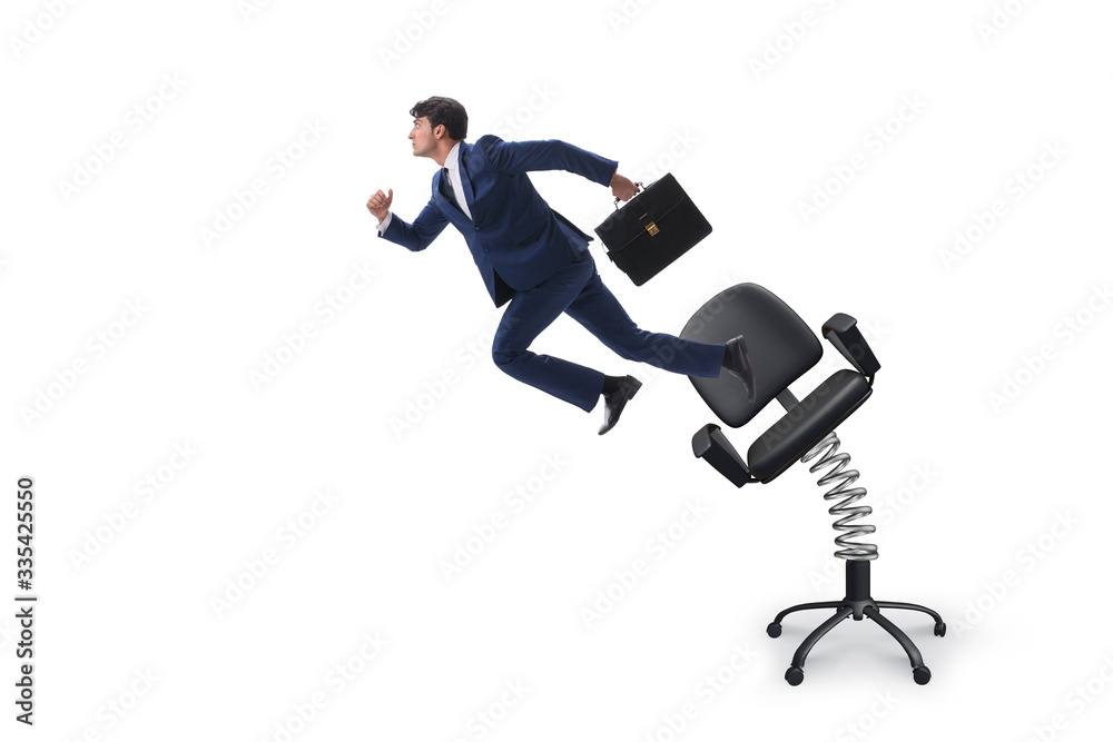 Promotion concept with businessman ejected from chair Promotion concept with businessman ejected from chair